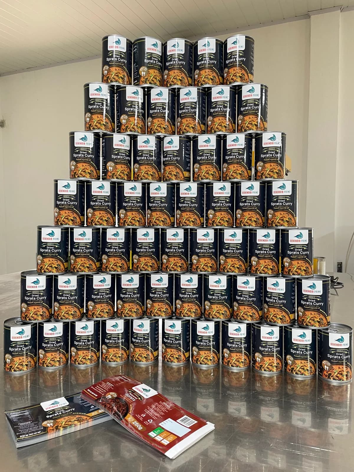 Rows of Serendib Prime Dried Sprats Curry tins packed and ready to ship